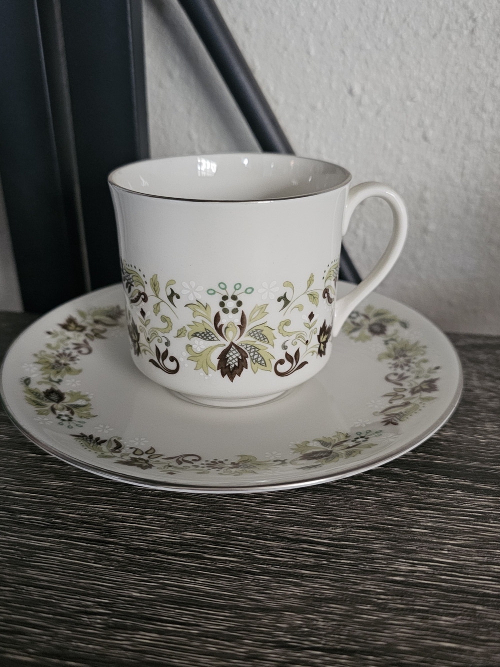 Classic White Porcelain Teacup and Saucer with Green Floral Pattern